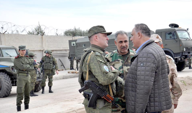 Russians guard al-Waer evac