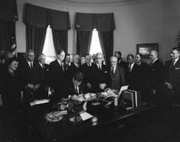 President Kennedy signs EO 10988