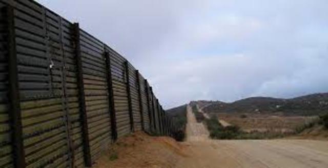 A bill to build a 700 mile fence along the Mexican border is signed