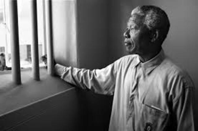 Nelson Mandela is arrested for treason