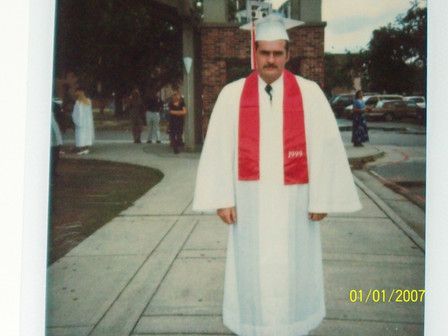 Me in my high school graduation cap and gown