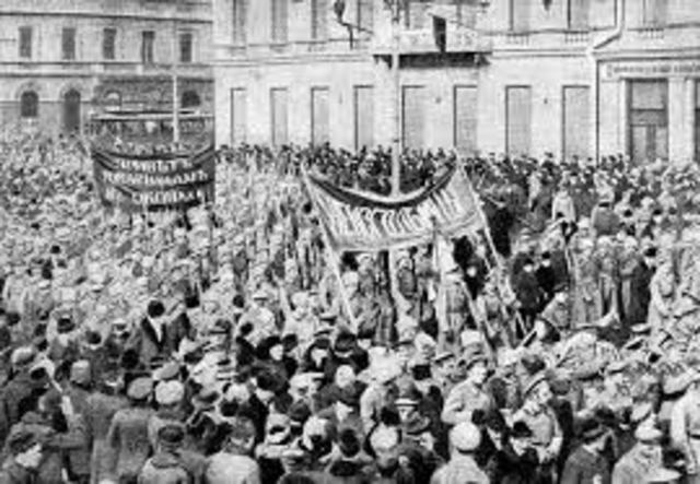 The February Revolution begins with strikes, demonstrations, and mutinies in Petrograd