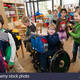 Non disabled and disabled students in this case a boy in a wheel chair dy9jf3