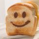 Prod close up of toast with smiley face