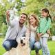 Depositphotos 85131370 stock photo happy family with dog taking