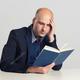 Depositphotos 113862216 stock photo serious man reading a book