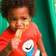 Black child eating popsicle