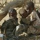 Darfur children sit under tree