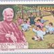 Maria montessori and group of children stamp