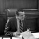 Harvey milk in 1978 at mayor moscone's desk crop