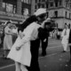 Sailor kissing girl