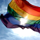 Rainbow flag and blue skies