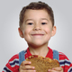 Toddler eating whole wheat sandwich