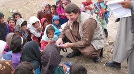 Timeline: Greg Mortenson's Journey. Scale: Afghanistan=Blue, Pakistan=Red, U.S.=Green, and Greg and his journey=Purple