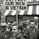 Men bearing signs to support u.s. troops in vietnam