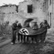 Canadian soldiers remove flag from bombed building ww2 1349850836 b