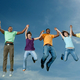 Happy healthy people jumping in air
