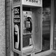 Pay phone hangs on wall