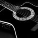 Sweet black acoustic guitar