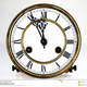 Old clock roman numerals mechanism face hands showing five minutes to midnight 48871572