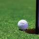 Golf ball and hole