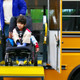Student in wheelchair using school bus lift 300x218