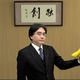 Satoru iwata e3 2012 holding bananas