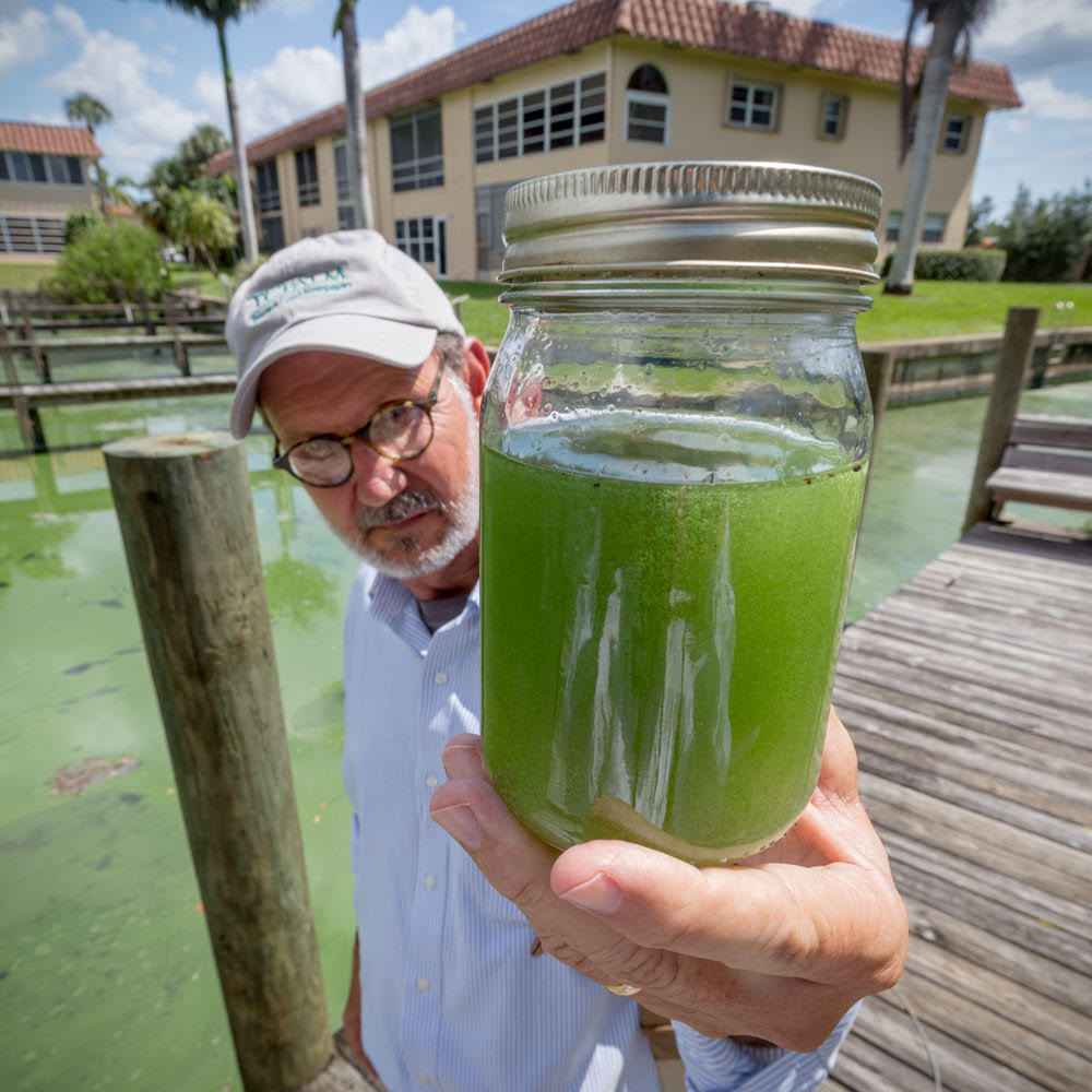 TC Palm's Tyler Treadway holds a fresh sample of Treasure Coast water