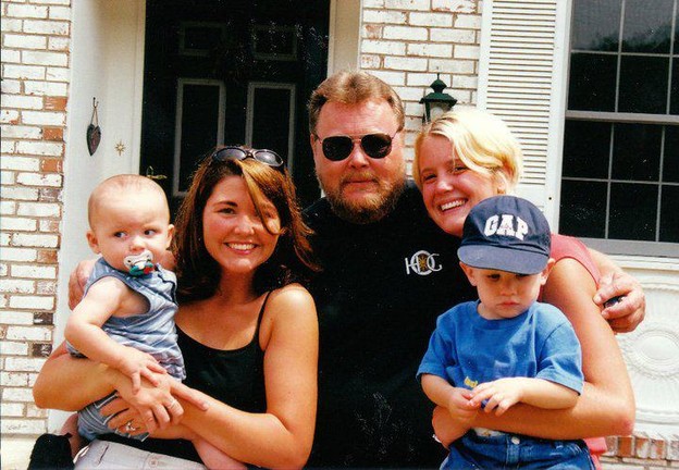 2002: Ken in front of his home in New Castle, Indiana with daughters Kris and Liz and grandsons Blake and Jack.