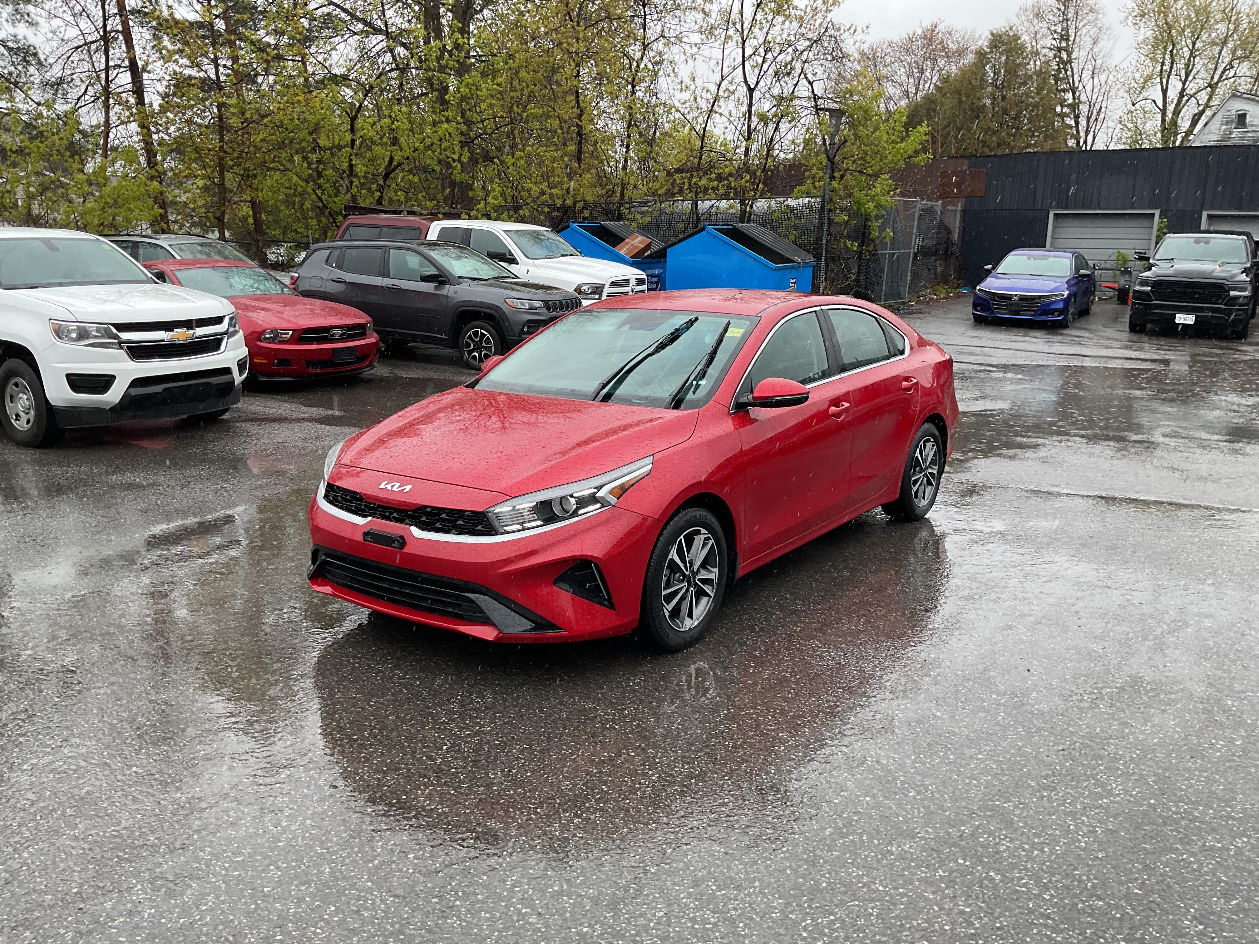 Red 2024 Kia Forte Sedan Continuously Variable Transmission