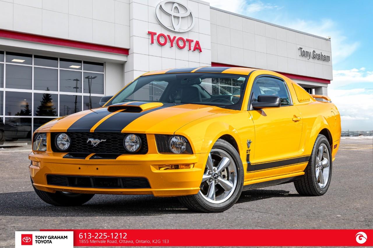 Orange 2009 Ford Mustang Coupe Rear-Wheel Drive 5-Speed Manual