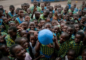Schoolchildren at the Challenging Heights School in Winneba, Ghana receive the One World Futbol. (Credit: Keri Oberly).