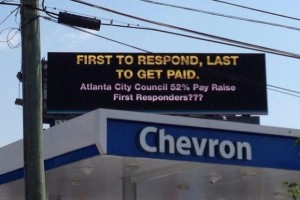This billboard that calls for pay hikes for public safety employees has been raised over Atlanta. Credit: AFR Report