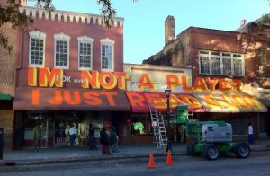 Buildings along Broad Street in downtown Atlanta, once known as Produce Row, were decorated during the Elevate art event in 2012. Credit: atlretro.com