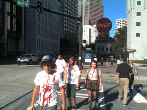 Extra in a zombie series filmed in the Fairlie-Poplar district of downtown Atlanta go home after work in October 2011. Credit: David Pendered