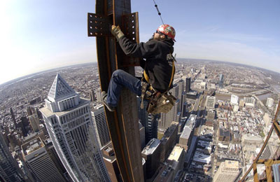 Photo of Ironworkers over Atlanta's skyline. They face one of the highest risks of death of any occupation. Credit: Ironworkers Local 387.
