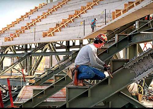 Jack Falls at work on the Olympic Stadium (AJC photo by Joey Ivansco)
