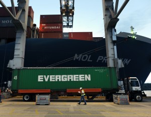 Cranes lift containers off ships and set them on trailers which will take them to a holding area. Credit: GPA