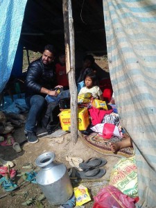 Nepalese earthquake refugees take shelter in a makeshift tent with food provided by health care workers affiliated with 50Cents.Period. Credit: Sunny Mir