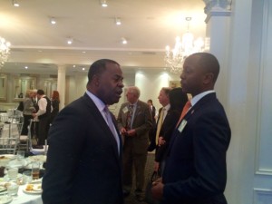 Atlanta Mayor Kasim Reed and APS Board Chair Courtney English huddle at the Buckhead Coalition luncheon on Wednesday (Photo by Maria Saporta)