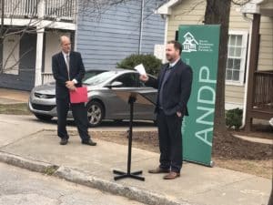 Casey Daniel, a vice president with Bank of America, said its funding of the down payment assistance program comports with the bank's mission. ANDP President/CEO John O'Callaghan listens. Credit: David Pendered
