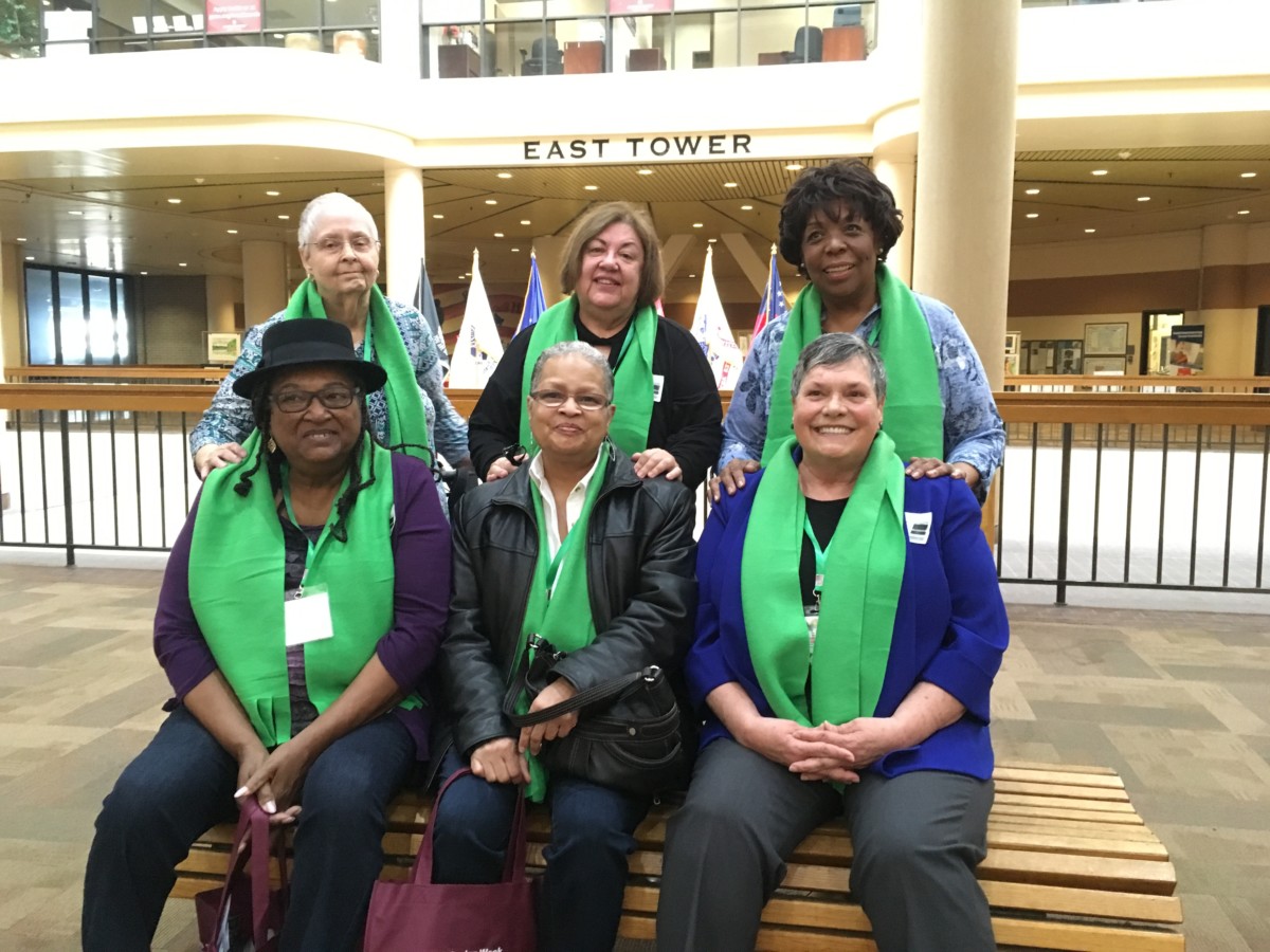 Members of The Oaks Resident Advocacy Group, pictured in a state office building en route to the Capitol on Wednesday. They're among the few hundred folks who have come to the state Capitol in Atlanta to advocate for seniors this year. Credit: Maggie Lee