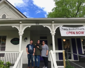 Charis' new location in Decatur with (L-R) Charis Circle Executive Director E.R. Anderson, and bookstore co-owners Sara Luce Look and Angel Gabriel. Front row: Jasmine. Credit: Kelly Jordan