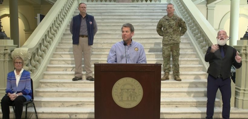 Brian Kemp at a podum