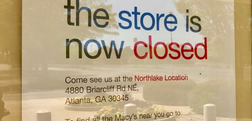 Sign in South DeKalb Macy's window reading "the store is now closed..."
