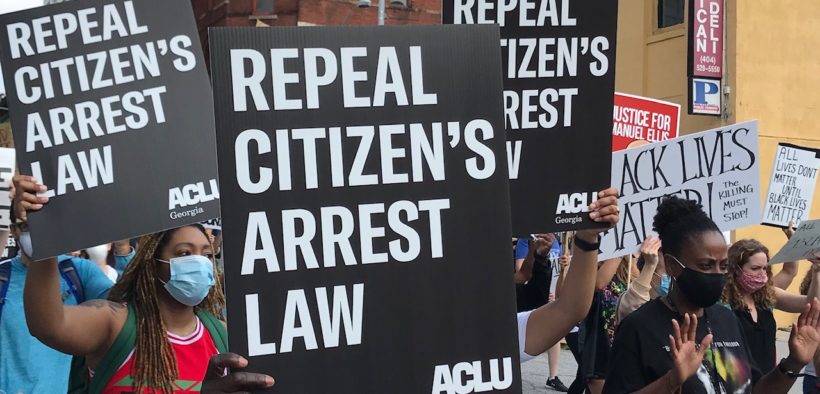 Marchers in Atlanta carry signs reading "Repeal Citizen's Arrest Law"