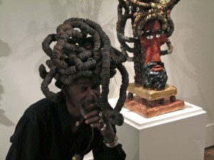 Gregory Warnack, "Mr. Imagination," with dreadlocks and a piece of art mimicking that hair style.