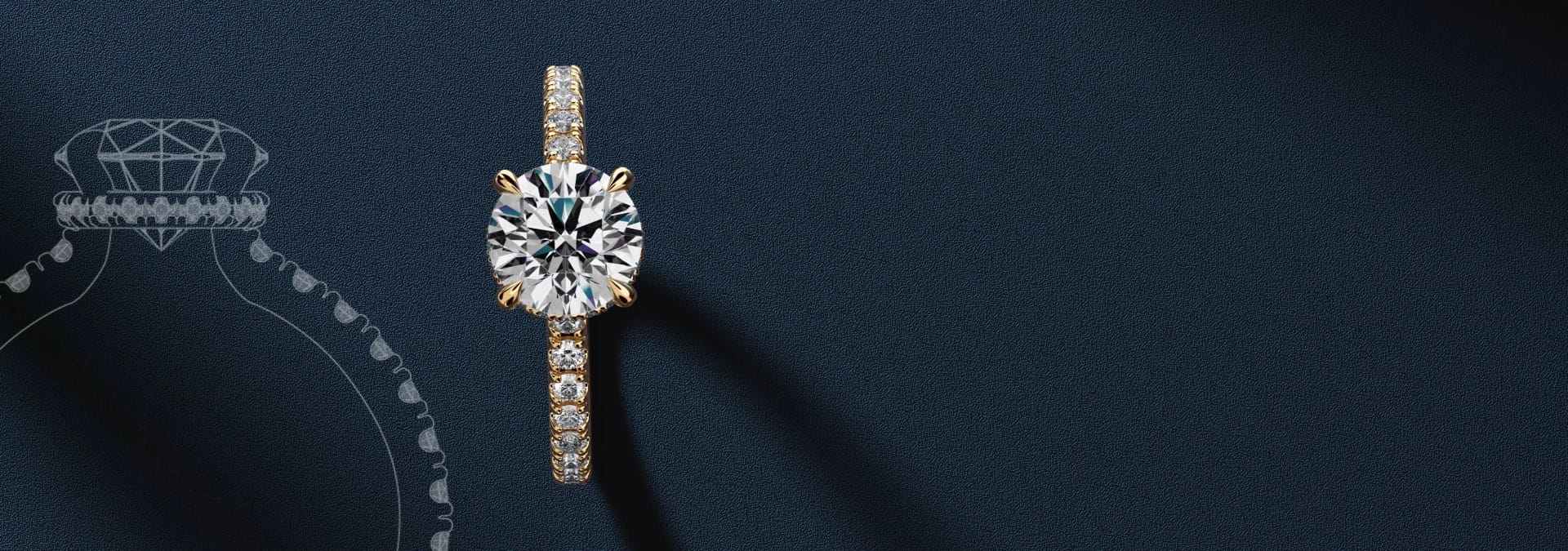 Elegant gold and diamond ring with a round brilliant-cut stone on a dark textured background.