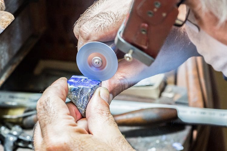 Jeweler Cutting Gemstone