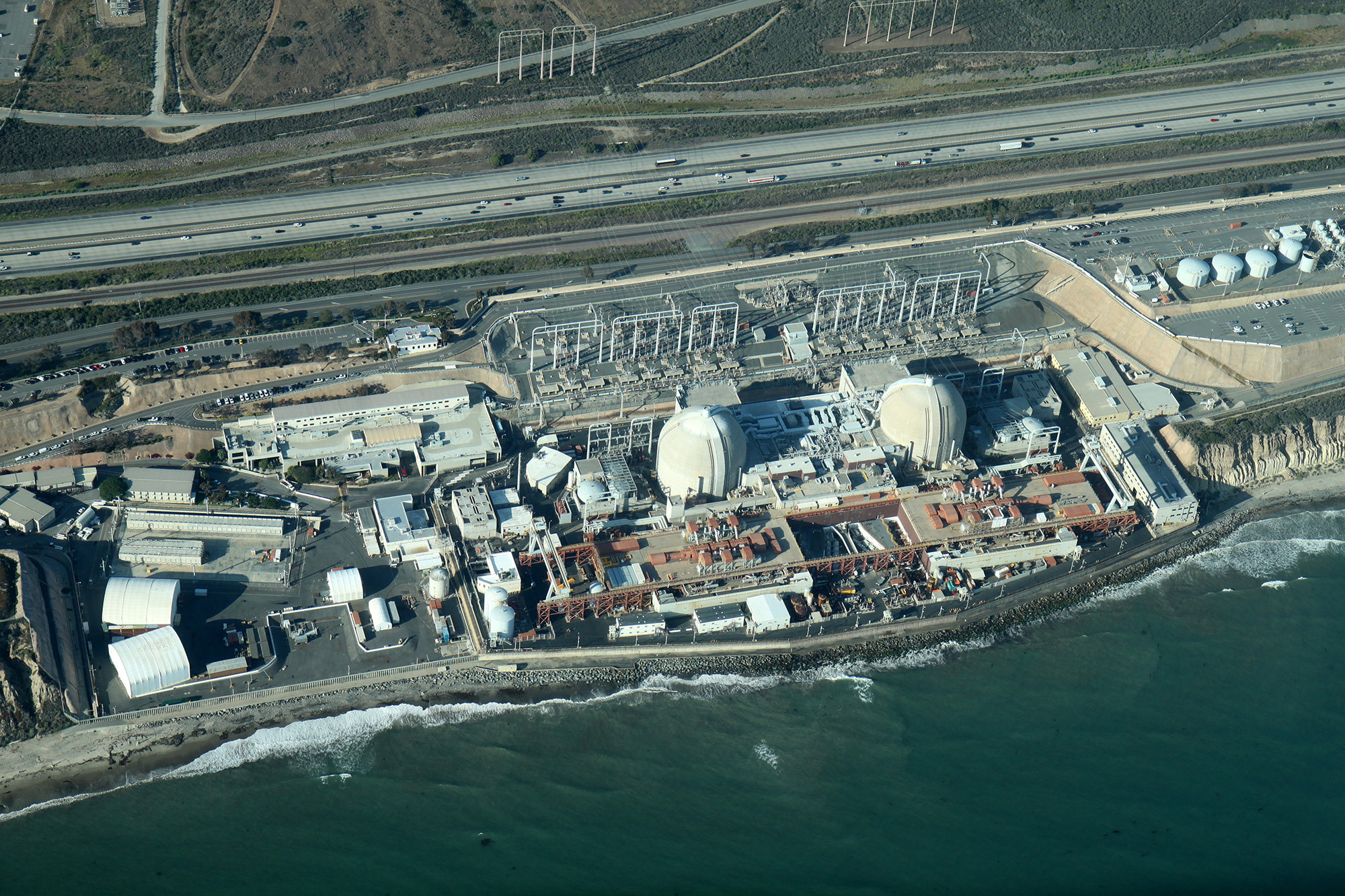 Facilities like power stations are often built on coasts to take advantage of an abundant supply of coolant or water for heating.